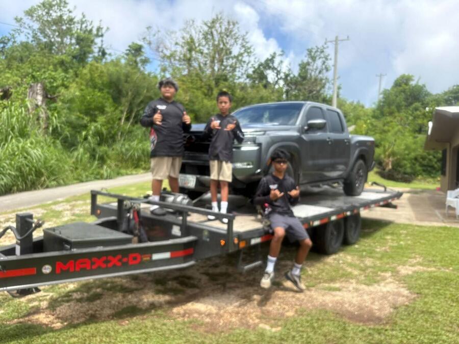 Dirty~Max crew loading a truck on the flatbed